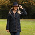 Waterproof Fernley weekend coat in navy worn in the countryside