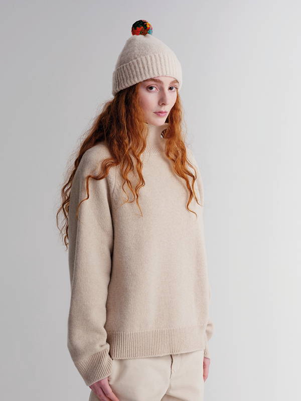 model wears Brushed Plain Hat Stripe Pompom Oatmeal