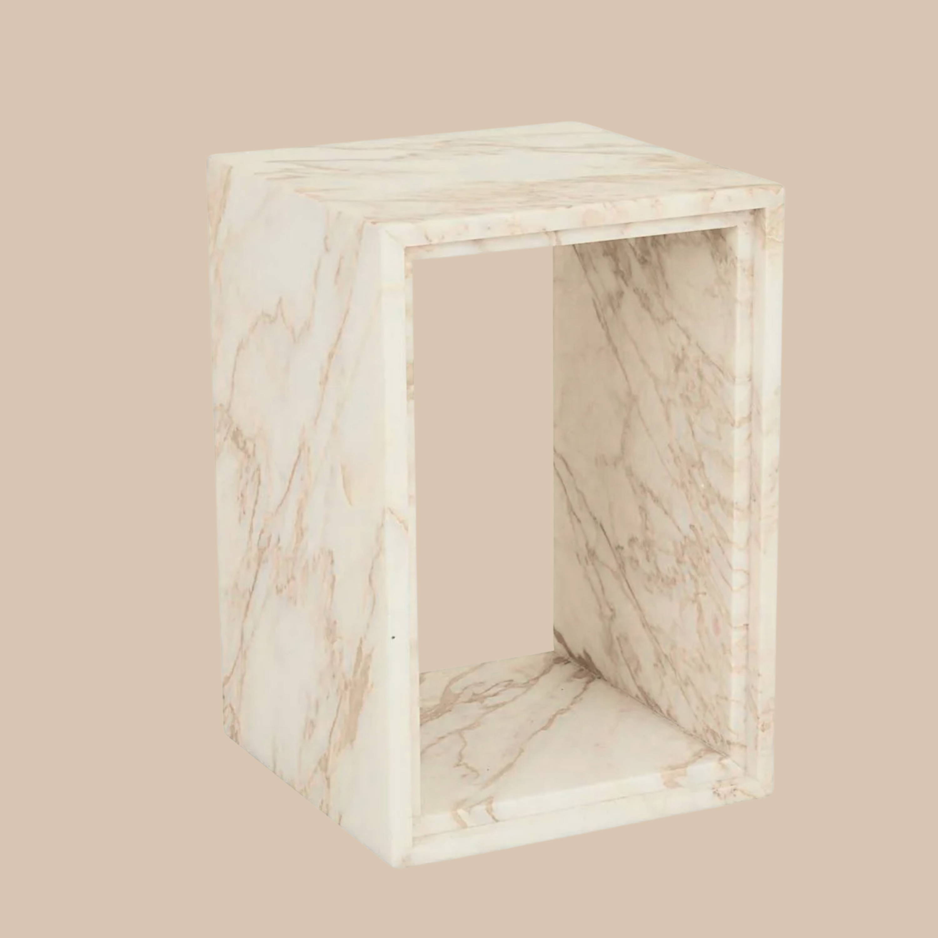 Ponte Side Table Golden White Marble by Framing Toat – A sculptural side table with a curved base and golden white marble top.