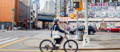 Electric bike rider on Chinatown street NYC