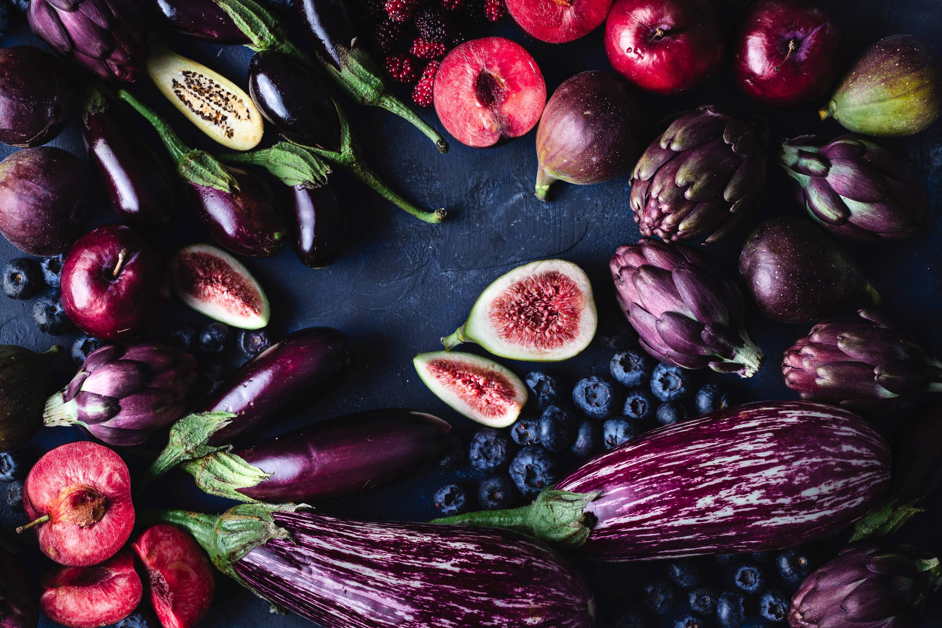 Different purply fruits such as figs, blueberries and aubergines