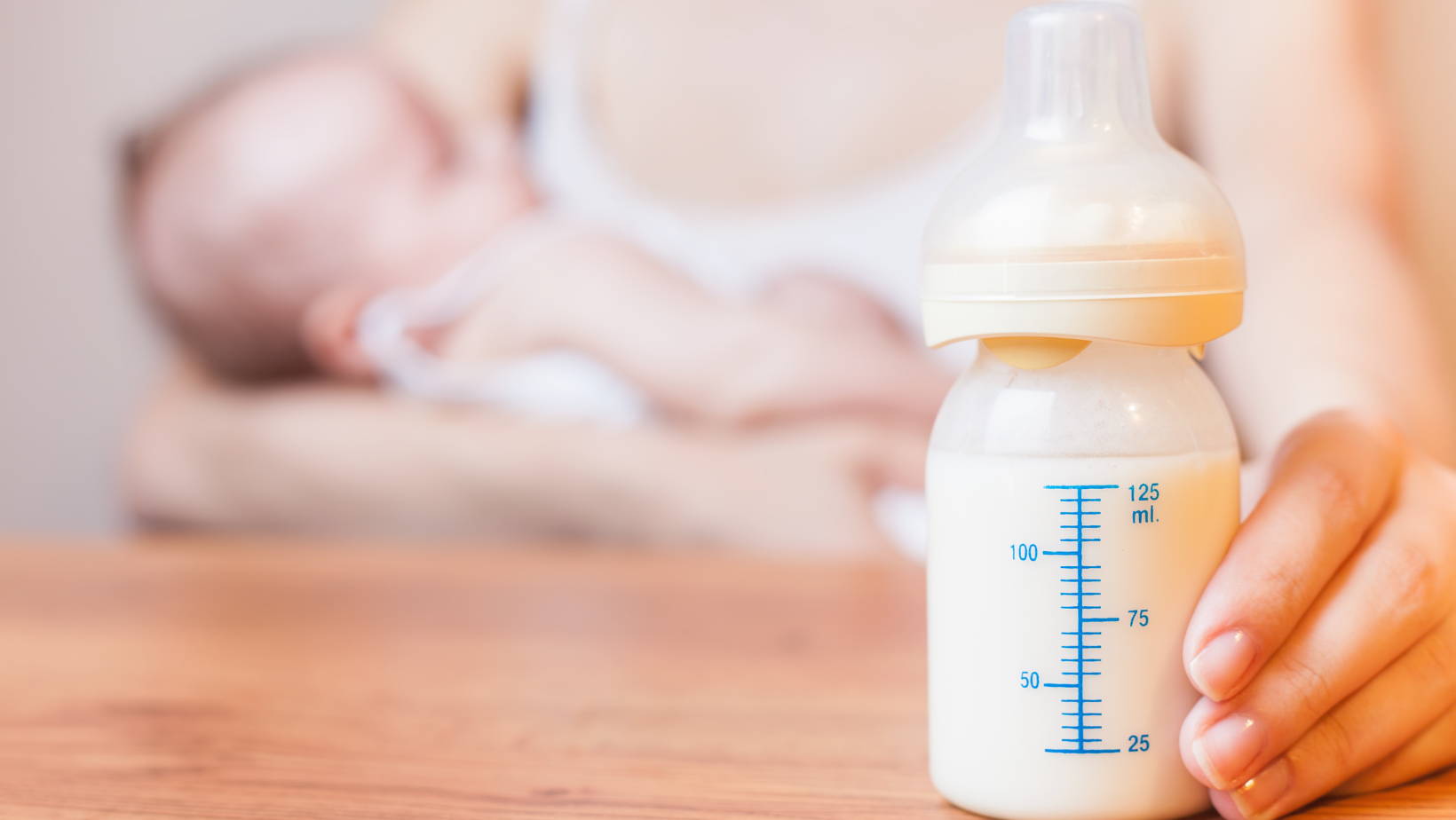 Mom Holding Baby and Bottle | My Organic Company