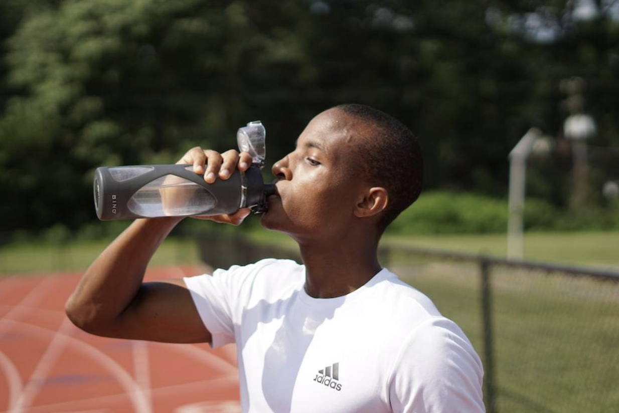 Drinking at least eight cups of water each day