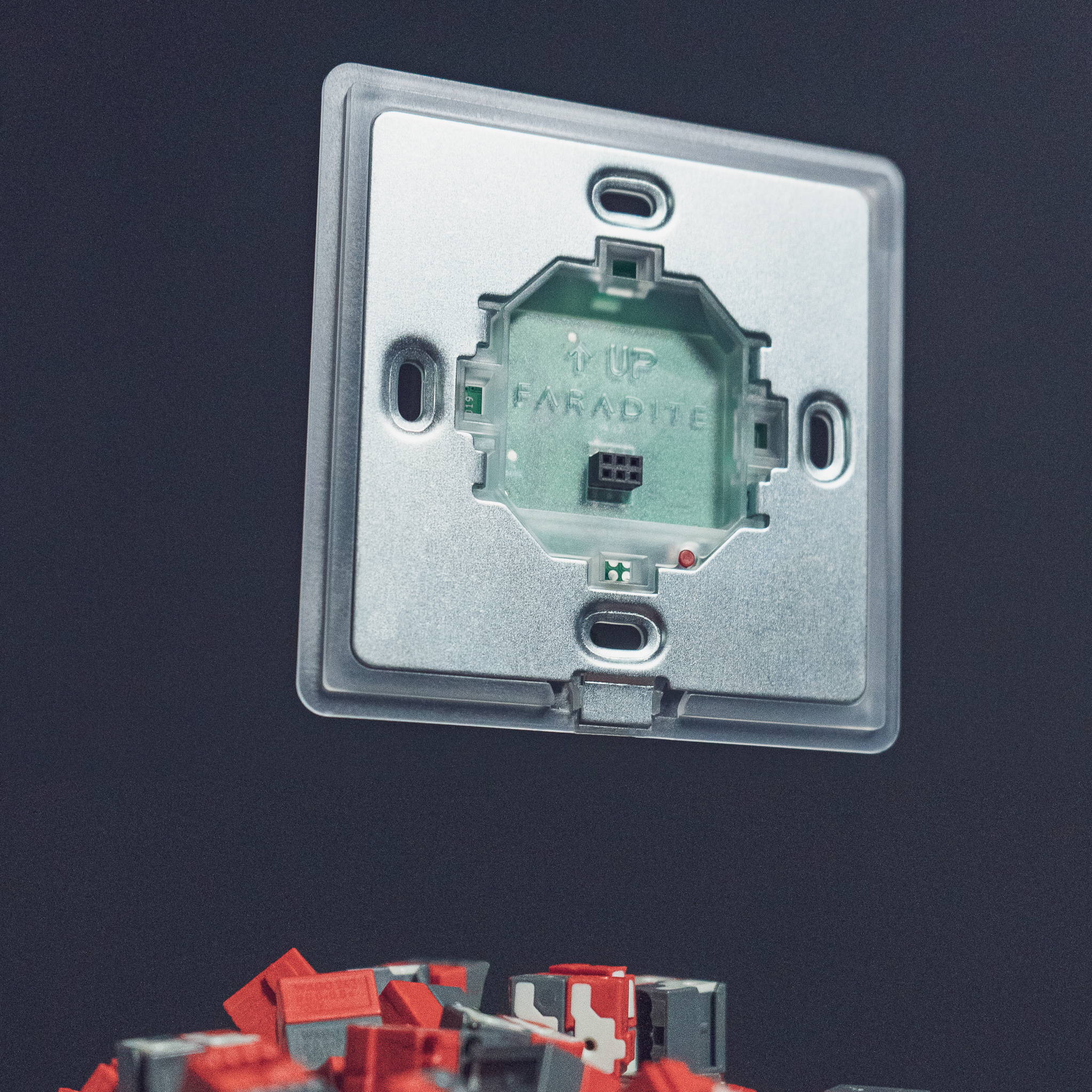 Faradite TAP-5 smart home light switch on decorative wall