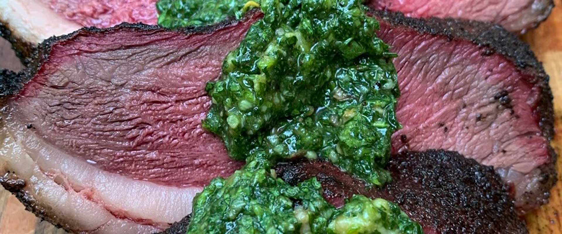 BetterFed Beef Certified ONYA® Picanha steak roast served with a bone marrow chimichurri sauce.