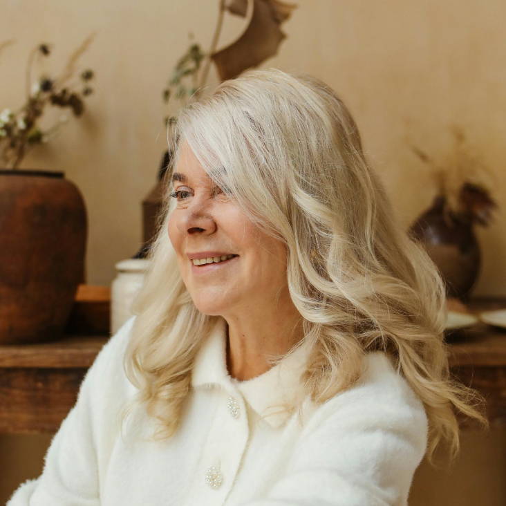 blonde woman with layered curls