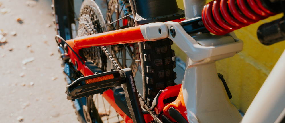 The rear suspension and tire on a mountain bike close up