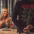 man-giving-roses-to-woman-first-date