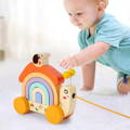 Little boy playing with Montessori Wooden Pulling Snail.