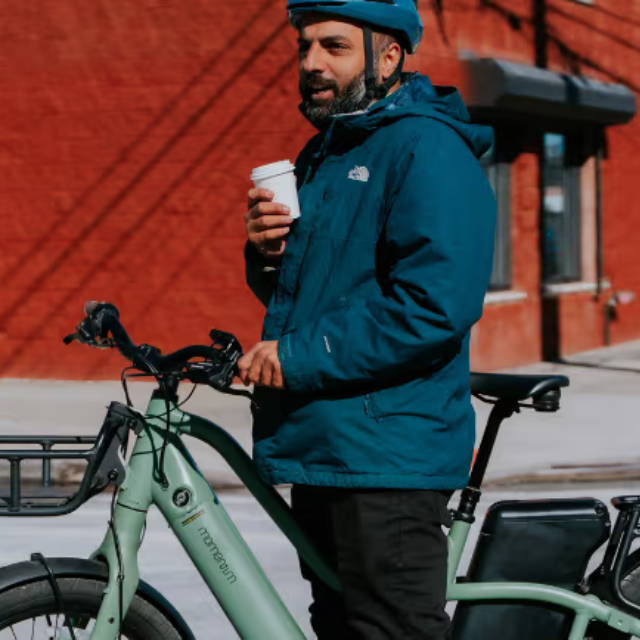 Rider on Momentum PakYak+ cargo electric bike
