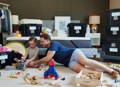 Father and son playing with wooden toys.