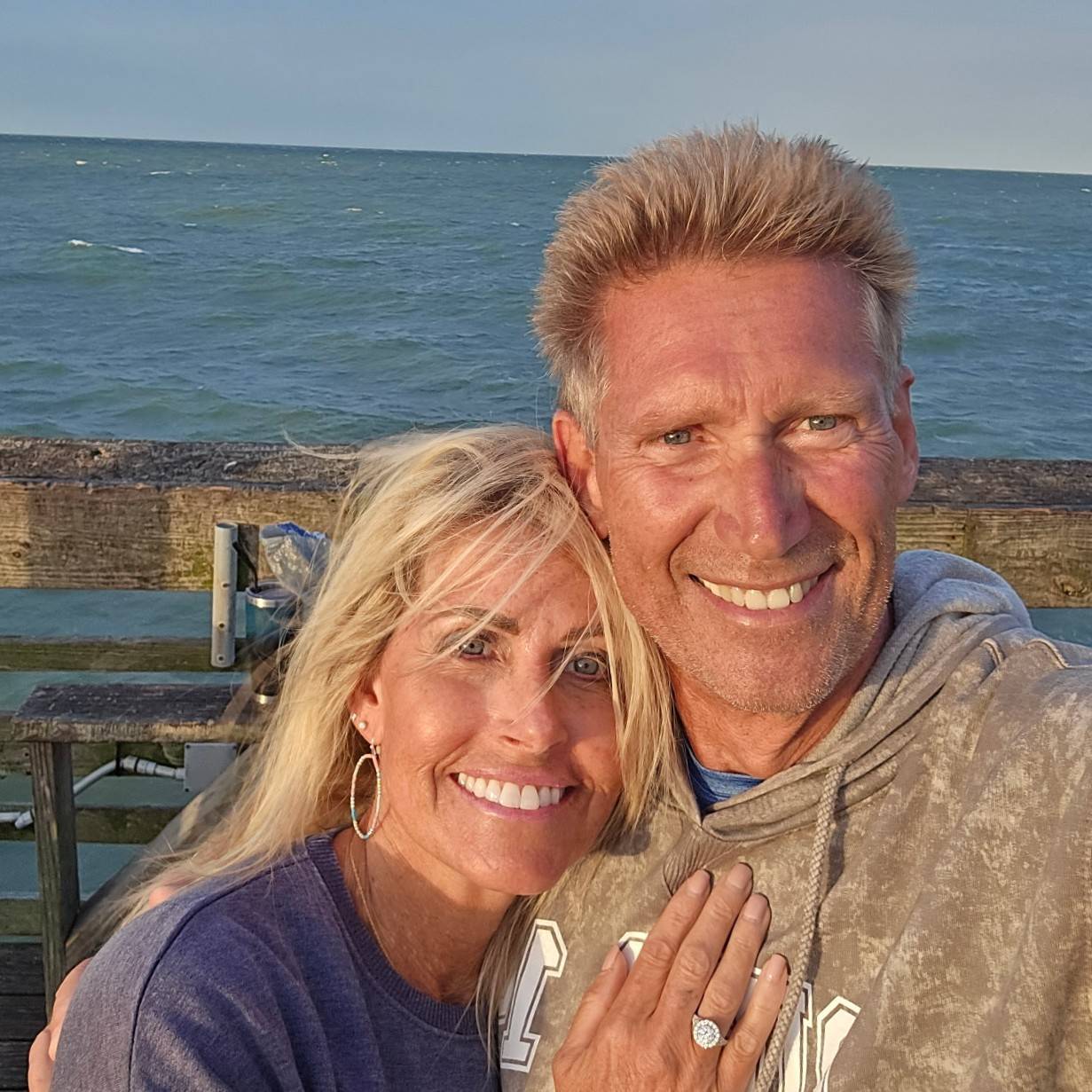Gerry Turner and Lana Sutton taking a selfie on a pier.