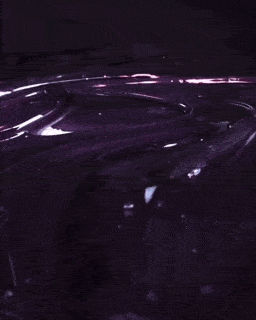 purple waxing gel being swirled
