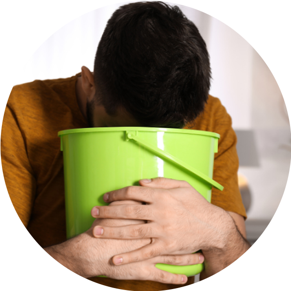 Man experiencing unexplained nausea, a possible sign of liver stress that may benefit from a milk thistle supplement.