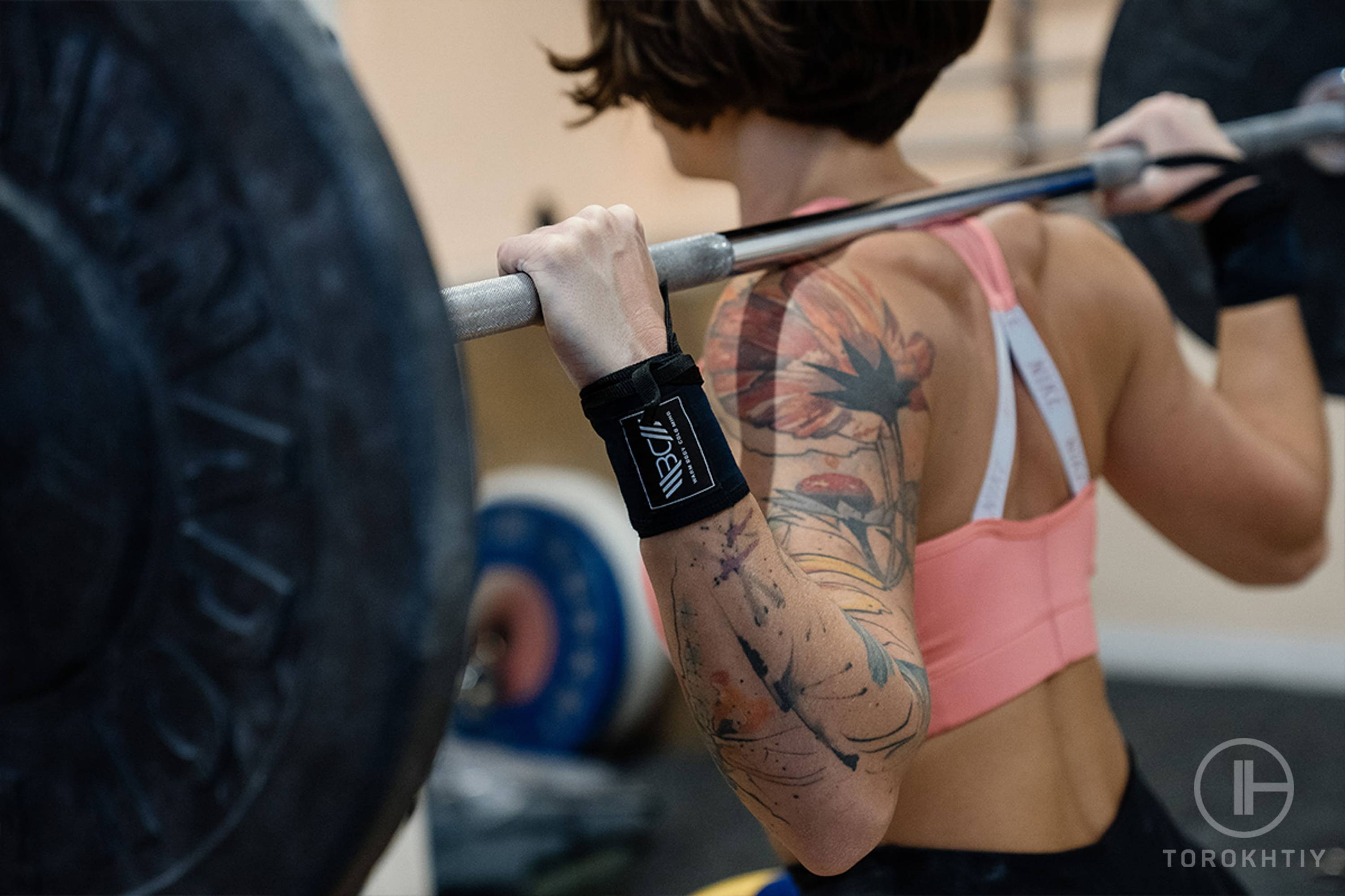 female athlete training with barbell female athlete training with barbell
