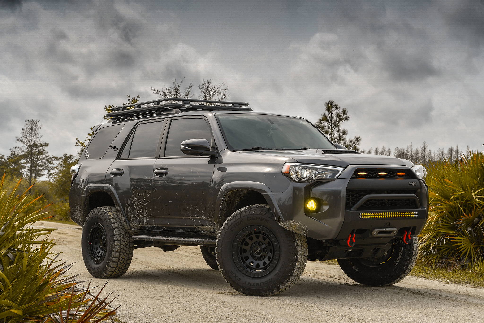 2019 Magnetic Grey Toyota 4-Runner Lifted with the HD Off-Road Overland Sector Venture Wheels in 17x9.0 in All Satin Black