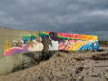 cleaning graffiti from a mural