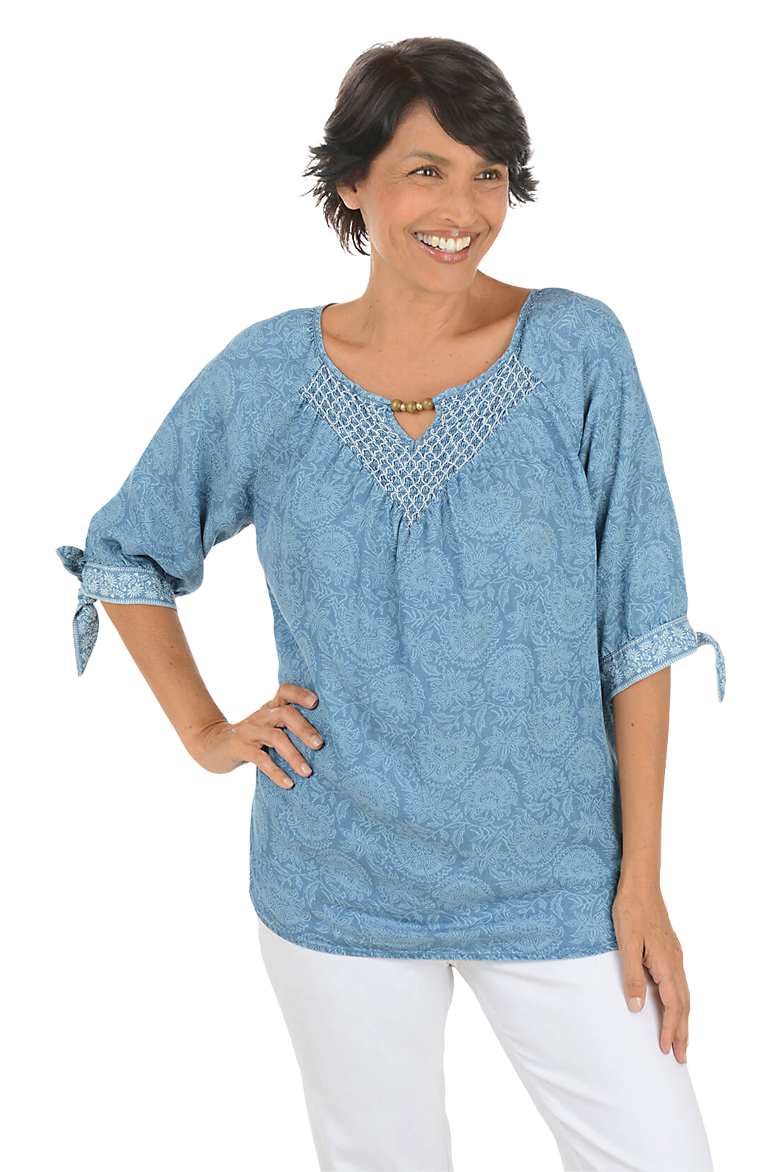 A woman wears a blue boho blouse.