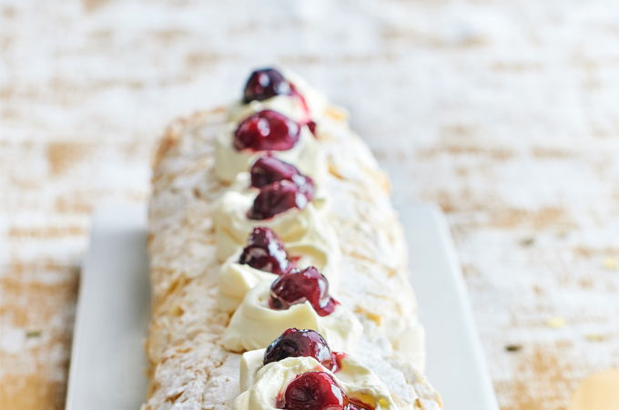 Pavlova Yule Log with Cherries and Almond Crème Anglaise