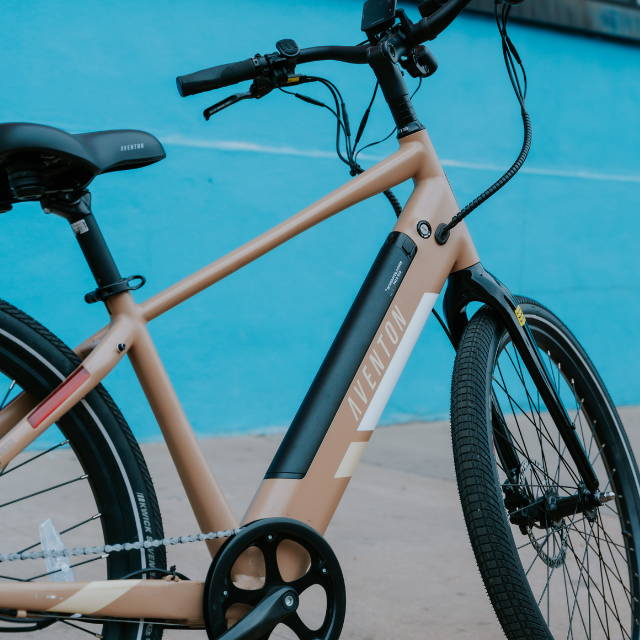 a tan Aventon Pace 500.2 electric city bike
