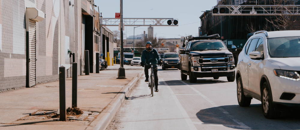 a man riding a Turbo Vado SL 4.0 electric road bike in a city