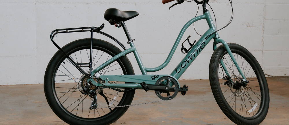 a teal Electra Townie electric cruiser bike