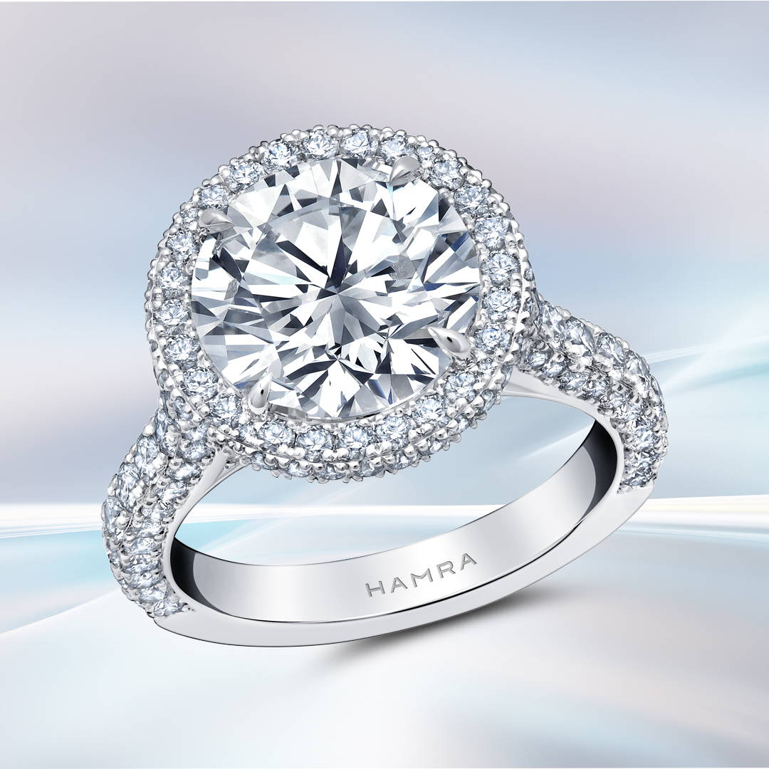round brilliant cut diamond engagement ring with diamond halo