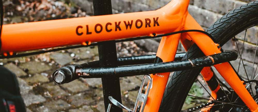 Clockwork electric bike locked to rack
