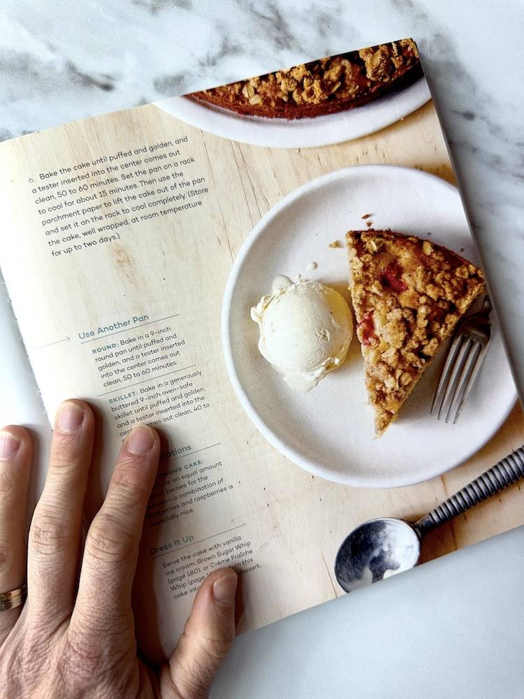 A cookbook page with instructions and a white bowl with ice cream and pie inside
