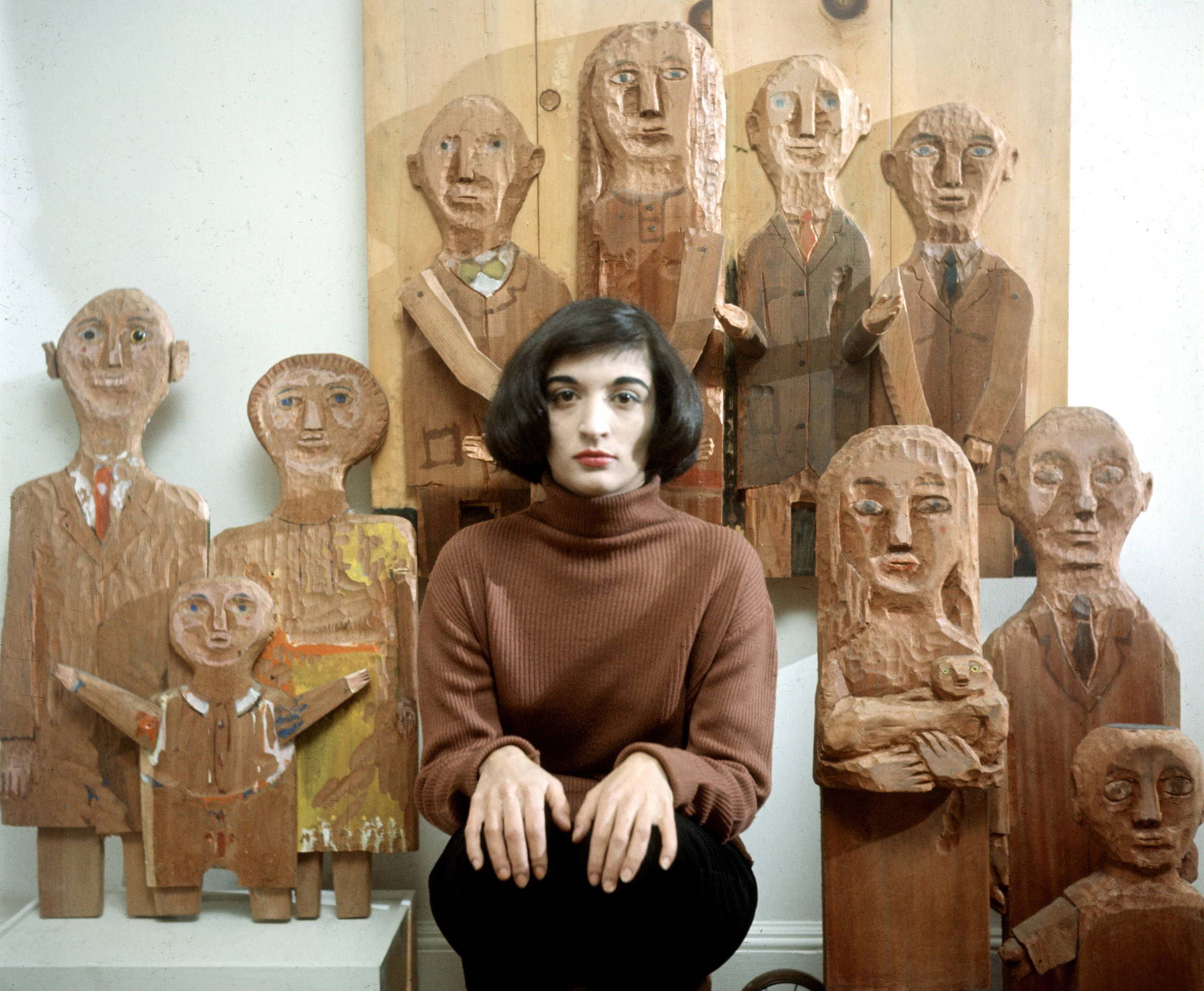 6 great female Latinx artists you should know -Portrait of French-born artist Marisol Escobar poses with some of her carved wooded sculptures. New York, New York, 1958. Courtesy Walter Sanders/The LIFE Picture Collection/Getty Images.