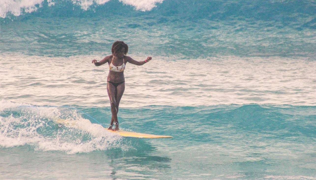 Chrissana Wilmot surfing in Tortola (BVI)