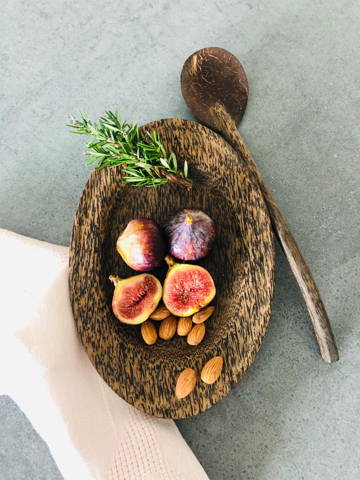 Wooden bowl with figs and nuts