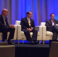 Tom Lydon talks to panelists.