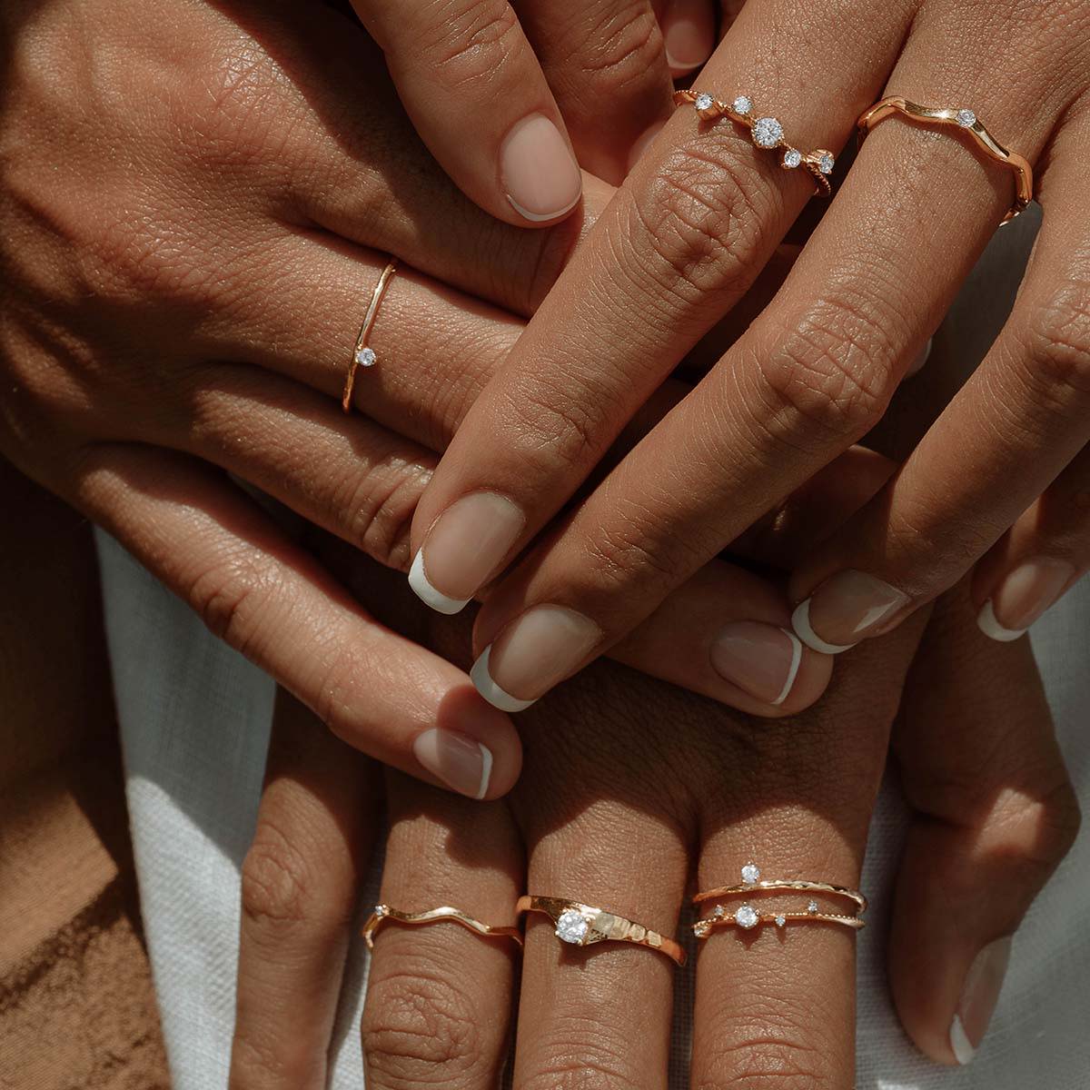 Hands wearing Scéona rings