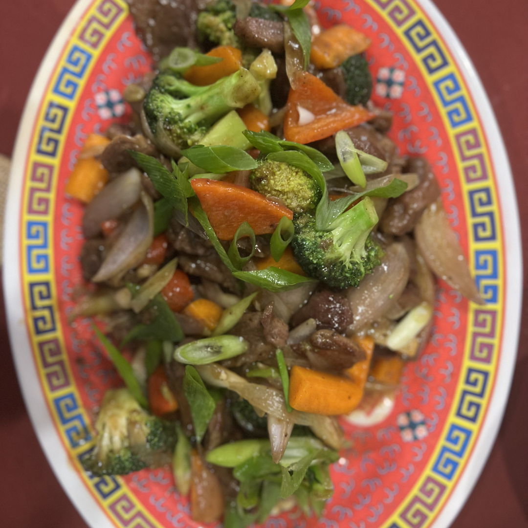 This is Pepper Steak. I have been experimenting with velveting meat. I wish I had started this journey sooner. I used Chuck or Flank steak for this dish and velveting cut the cooking time significantly and the meat was silky and soft. 
https://thewoksoflife.com/pepper-steak-recipe/