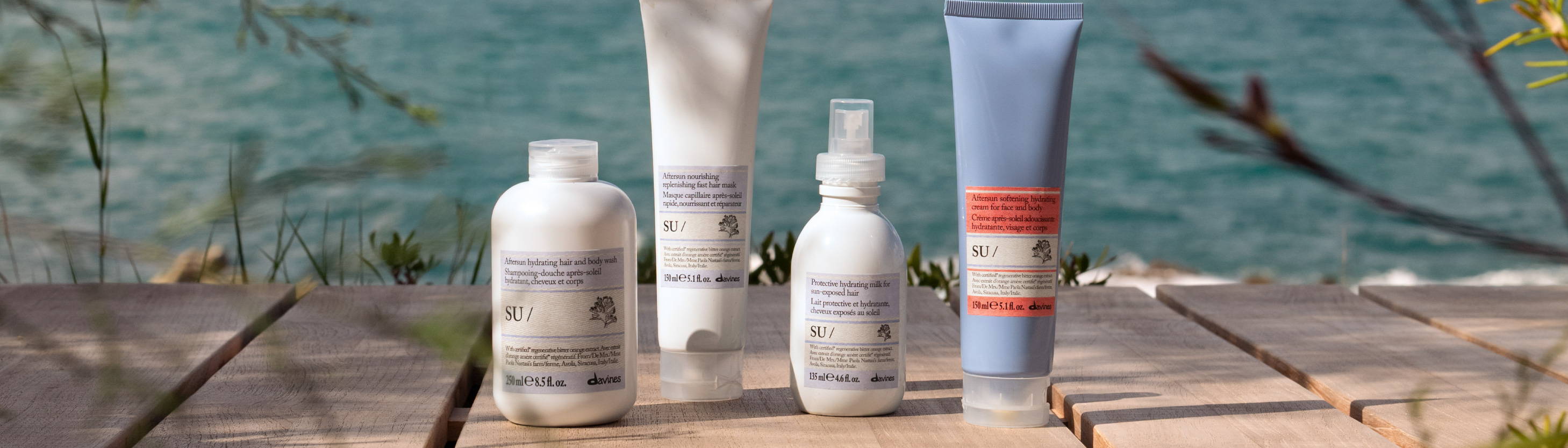 Davines SU products with an ocean background