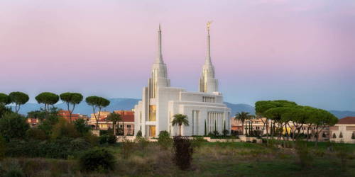 Picture of the Rome Temple against a blue and purple sky. 
