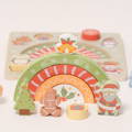 Green, red, and yellow arches, Christmas tree, cookie, present, and Santa figurines with the puzzle board visible in the background.