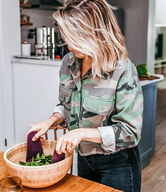 Nutritionist cooking in kitchen