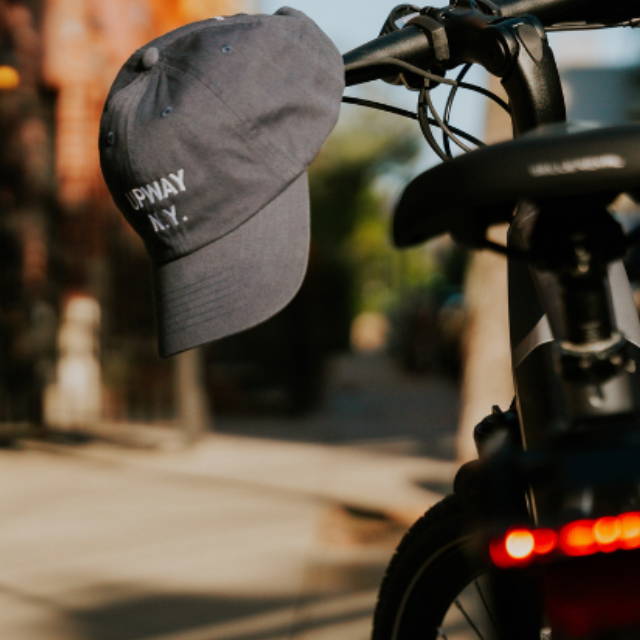 an electric bike with an upway hat on it in the city