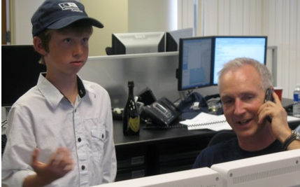 Mark Sear with his son. The family joins the celebration but clients have to be called.