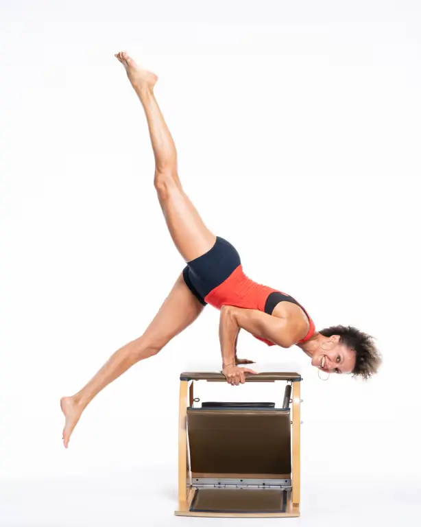 Image of Brooke smiling while exercising on the wunda chair