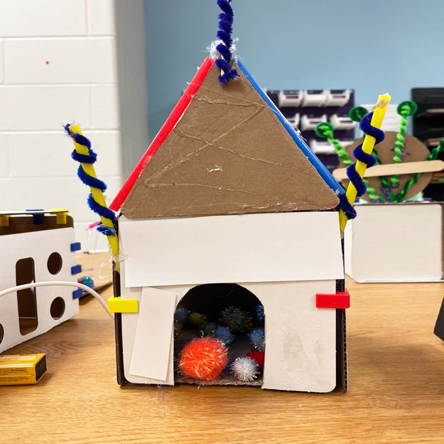 closeup photo of student cardboard model for class project