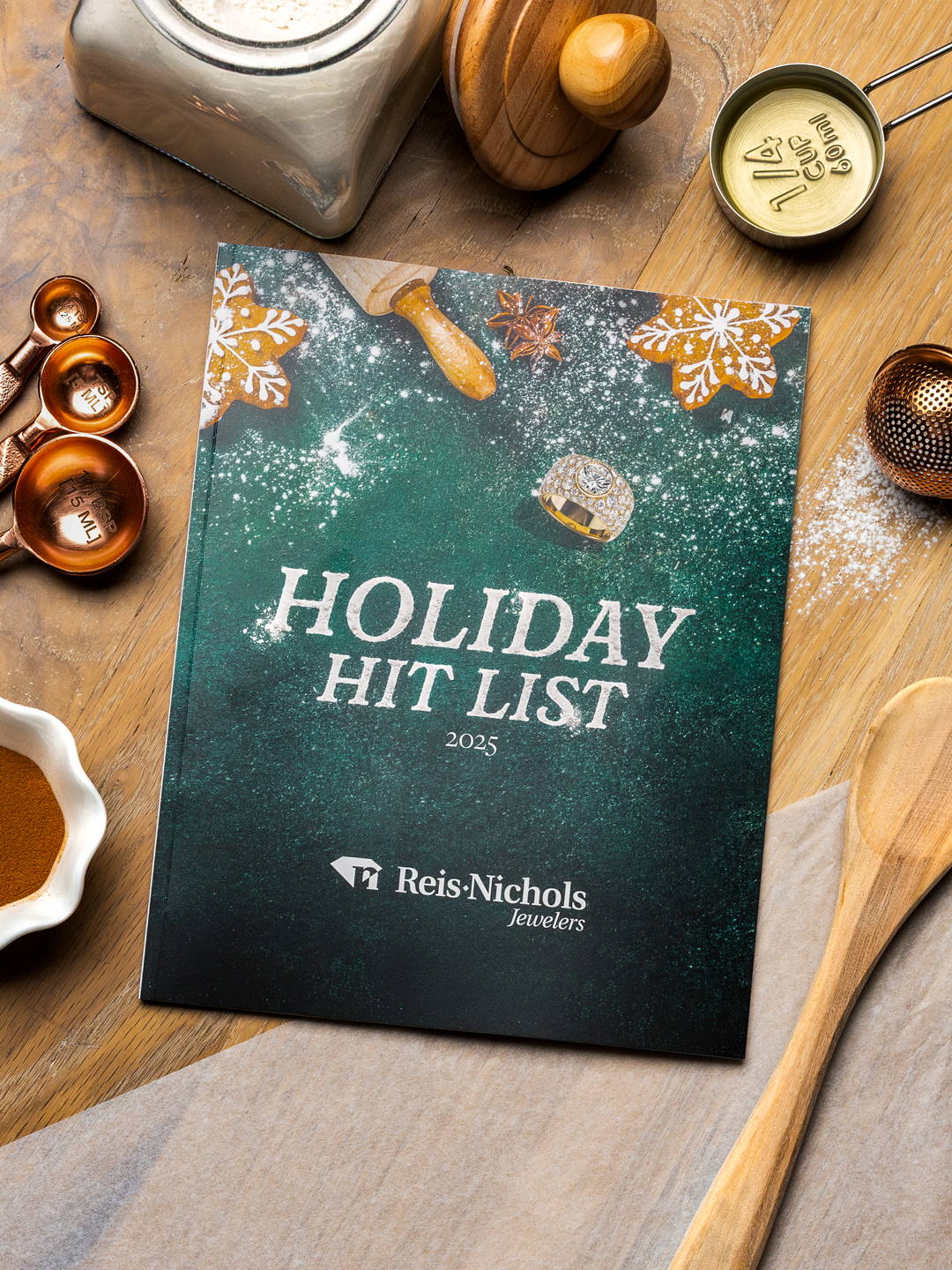 Breitling Superocean Heritage Event Reis-Nichols Holiday Hitlist Catalog laying on background surrounded by baking objects