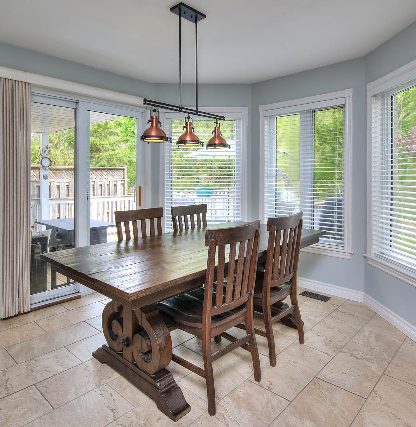 dining room featuring tile flooring and natural light