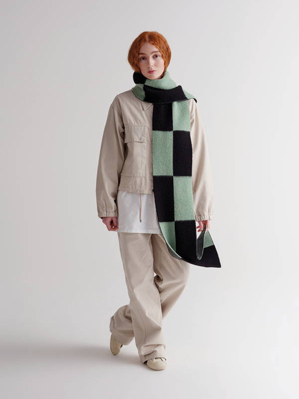 model wears Brushed Two Colour Big Rectangles Scarf Black & Sage