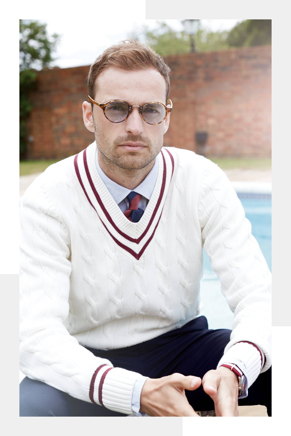 Model wearing the Alan Paine cricket sweater in colourway ecru with a claret trim.