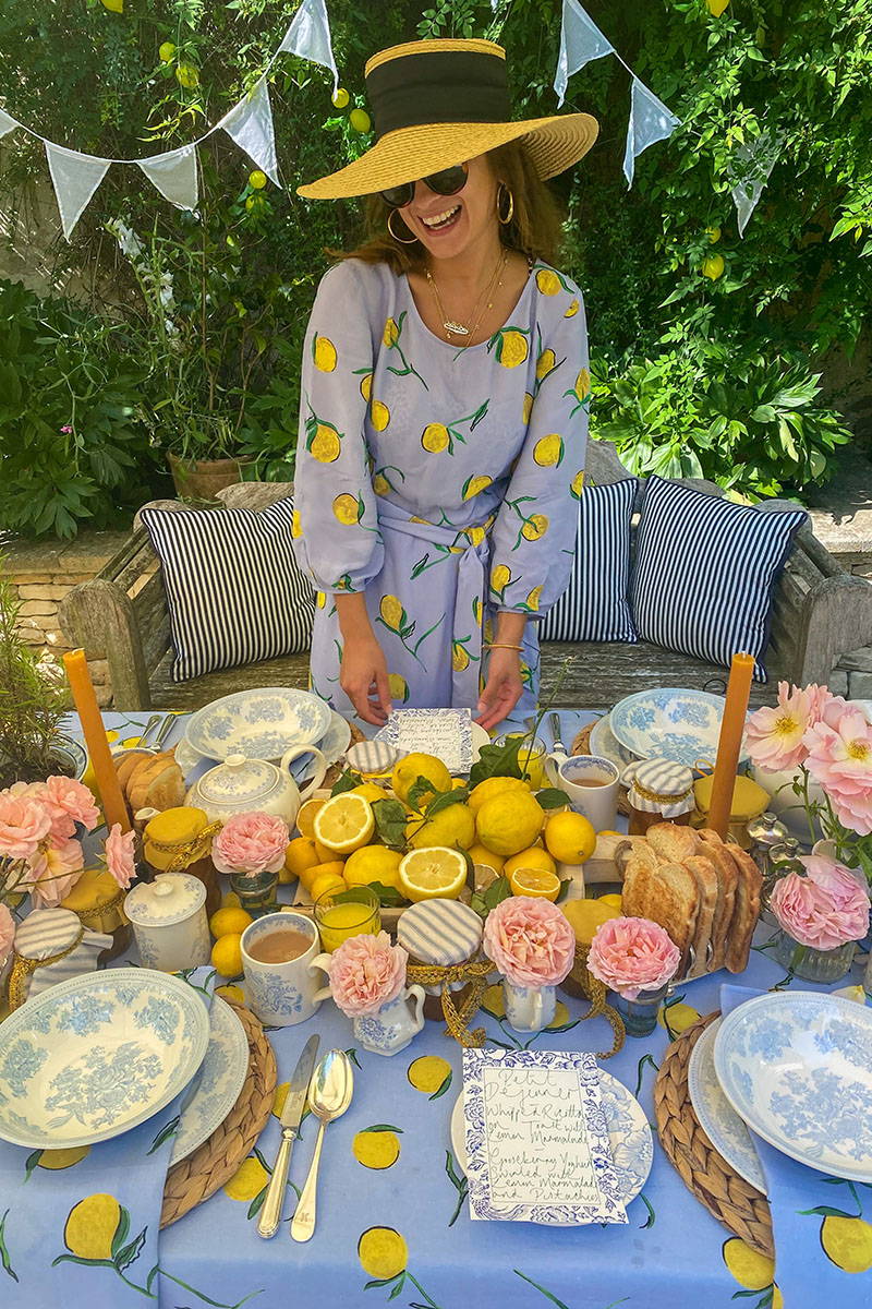 Rowan Blossom stands in front of her lemon tablescape