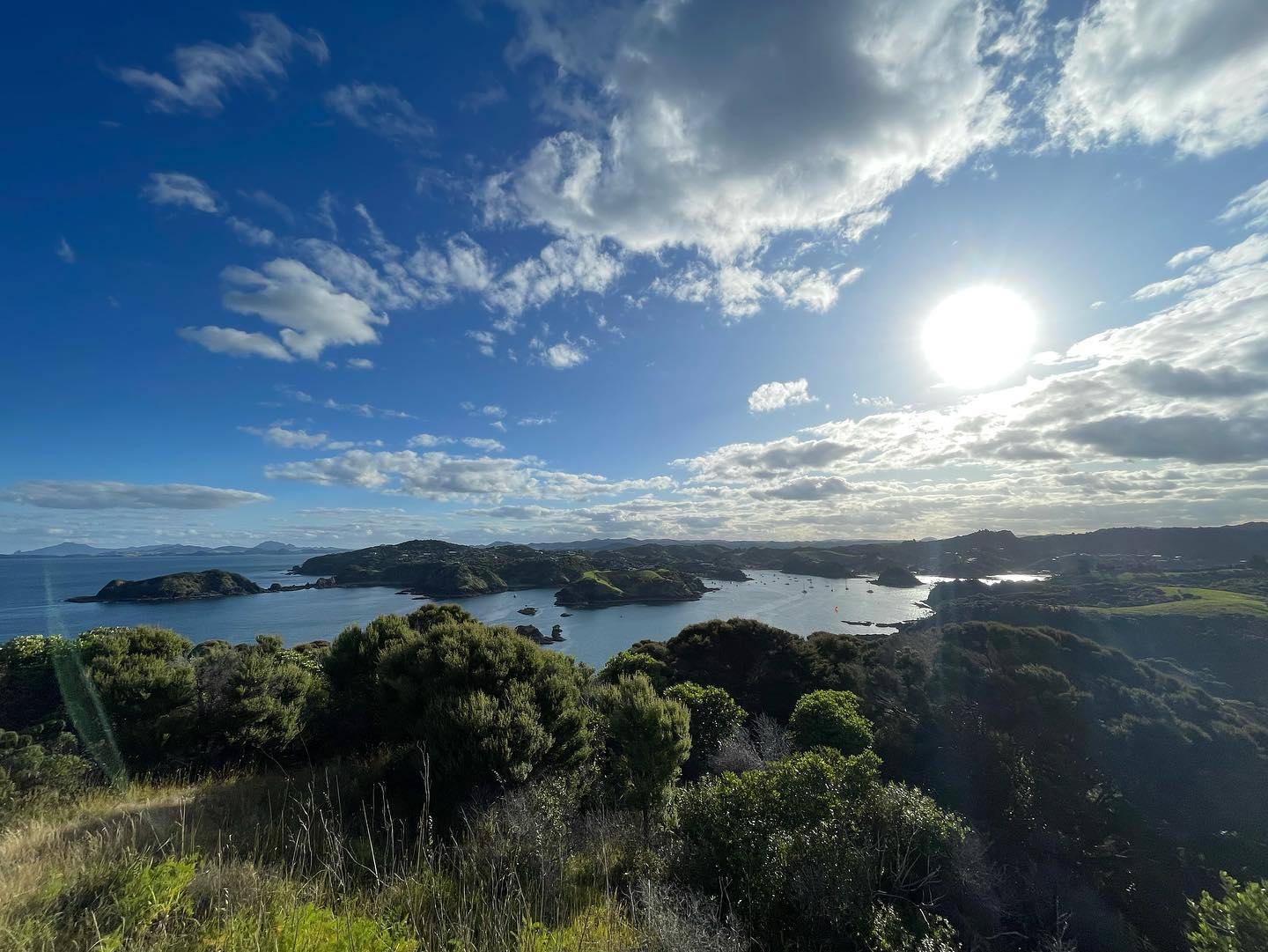 Sunny day with a beautiful viewpoint after a hike on an island shows many surrounding islands