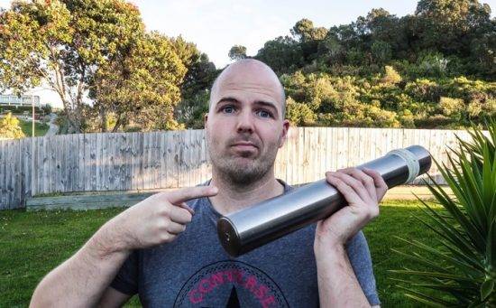 Magnus holding a bar of titanium